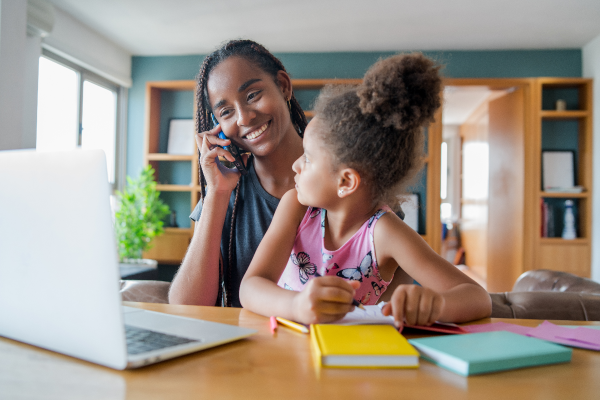 mom on phone with consultation with her daughter